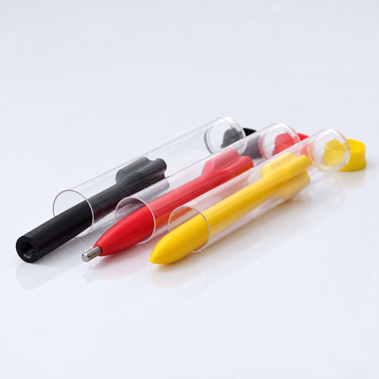 Rückschlagstift-Set – schwarzer Rückschlagstift mit Gewinde, roter mit Titanspitze und gelber, jeweils in Klarsichtröhre